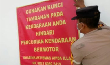 Bhabinkamtibmas Polsek Palas  Polres Lampung Selatan  Pasang Banner “HIMBAUAN PASANG KUNCI GANDA KENDARAAN BERMOTOR”