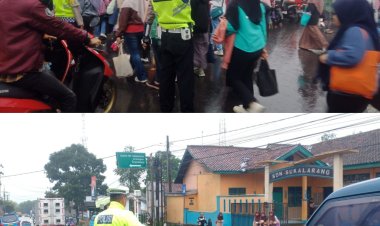 Diguyur Hujan, Polisi Tetap Mengatur Arus Lalu Lintas